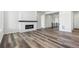 Spacious living room features hardwood floors, a fireplace, and bright, natural light at 9688 Winterset Cir, Littleton, CO 80125