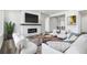 Bright living room features a cozy fireplace and stylish decor, creating an inviting atmosphere at 9688 Winterset Cir, Littleton, CO 80125