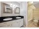 Bright bathroom featuring dual sinks with granite countertop, shower and tile flooring at 7995 E Mississippi Ave # 24, Denver, CO 80247