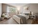 Cozy bedroom with neutral tones, plush bedding, natural light, and stylish furnishings at 7995 E Mississippi Ave # 24, Denver, CO 80247