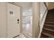 Inviting foyer with white front door, tiled entryway and wood-look flooring at 7995 E Mississippi Ave # 24, Denver, CO 80247
