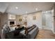 Open living room with fireplace and seamless access to the dining area at 7995 E Mississippi Ave # 24, Denver, CO 80247