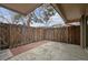 Private patio area with a wooden fence, brick accents, perfect for relaxing at 7995 E Mississippi Ave # 24, Denver, CO 80247