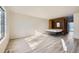 Bedroom with a wall bed, light walls, and wood-look floors at 61 S Sable Blvd # C14, Aurora, CO 80012