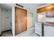 Kitchen area with wood cabinets and white appliances at 61 S Sable Blvd # C14, Aurora, CO 80012