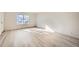 Spacious living area with wood-look floors and large window at 61 S Sable Blvd # C14, Aurora, CO 80012