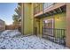 Private patio area with rock landscaping and a wood fence at 61 S Sable Blvd # C14, Aurora, CO 80012