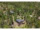 A high angle aerial shot of a home in a forest setting offering great privacy at 30866 Kings Valley Way, Conifer, CO 80433