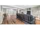 Finished basement with wood laminate flooring, entertainment area, and neutral paint at 30866 Kings Valley Way, Conifer, CO 80433