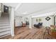 Finished basement space with wood laminate flooring, neutral paint, and natural light at 30866 Kings Valley Way, Conifer, CO 80433