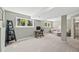 Finished basement featuring carpeted floors, large windows, and a seating area at 30866 Kings Valley Way, Conifer, CO 80433