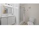 Updated bathroom featuring modern vanity, decorative patterned flooring, and a shower at 30866 Kings Valley Way, Conifer, CO 80433