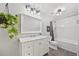 Stylish bathroom with modern vanity, subway tile shower, and elegant lighting fixtures at 30866 Kings Valley Way, Conifer, CO 80433