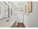Bathroom featuring marble countertops, a glass enclosed shower, and a single sink at 30866 Kings Valley Way, Conifer, CO 80433