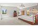 Spacious bedroom features vaulted ceilings, closet, ensuite bathroom, and plenty of light at 30866 Kings Valley Way, Conifer, CO 80433