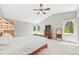 Bedroom with vaulted ceilings, natural light, ceiling fan and neutral color palette at 30866 Kings Valley Way, Conifer, CO 80433