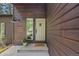 Close-up of the home's entrance showcasing the front door and well-kept exterior at 30866 Kings Valley Way, Conifer, CO 80433