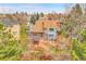 Backyard aerial view of home featuring an expansive pergola, patio, and mature landscaping at 12718 W 84Th Dr, Arvada, CO 80005