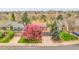 An aerial view of the home and its well-maintained landscaping in a quiet neighborhood at 12718 W 84Th Dr, Arvada, CO 80005