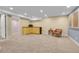 Finished basement featuring plush carpeting, recessed lighting, and a corner cabinet at 12718 W 84Th Dr, Arvada, CO 80005