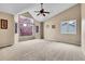 The bedroom has large windows providing natural light and neutral walls at 12718 W 84Th Dr, Arvada, CO 80005