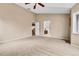 Open bedroom connects to an ensuite bathroom and staircase at 12718 W 84Th Dr, Arvada, CO 80005