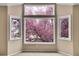 Bright bedroom view showcases the natural beauty and tranquility outside at 12718 W 84Th Dr, Arvada, CO 80005