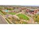 Attractive community center featuring a pool, amphitheater, and well-manicured lawns for outdoor enjoyment at 12718 W 84Th Dr, Arvada, CO 80005