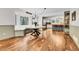 Dining area with built-in bench seating, a round wooden table, and views of the well-landscaped yard at 12718 W 84Th Dr, Arvada, CO 80005