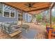 Outdoor patio with a seating area, brick flooring, and a covered structure at 12718 W 84Th Dr, Arvada, CO 80005