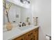 Bright bathroom featuring a wood vanity, modern fixtures, and a large mirror at 7910 Hooker St, Westminster, CO 80030
