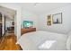 Bedroom showcasing wood floors, comfortable bed, dresser and stylish wall art at 7910 Hooker St, Westminster, CO 80030