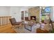 Inviting living room with hardwood floors, stone fireplace, and modern decor at 7910 Hooker St, Westminster, CO 80030