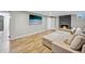 Living room with tile floors, a sectional sofa, a fireplace and mounted television at 7910 Hooker St, Westminster, CO 80030