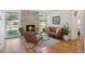 Spacious living room boasting hardwood floors, stone fireplace, and natural light at 7910 Hooker St, Westminster, CO 80030