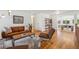 Open-concept living room with hardwood floors, stylish furniture, and ample space at 7910 Hooker St, Westminster, CO 80030