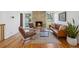 Bright living room featuring a stone fireplace, hardwood floors, and stylish furniture at 7910 Hooker St, Westminster, CO 80030