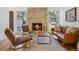 Cozy living room with stone fireplace, hardwood floors, and comfortable seating at 7910 Hooker St, Westminster, CO 80030