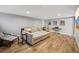 Spacious living room with tile floors, a sectional sofa, and a relaxing seating area at 7910 Hooker St, Westminster, CO 80030