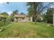 View of the back exterior showcasing a well-maintained home and a lush green yard, ideal for relaxation at 1340 Iola St, Aurora, CO 80010