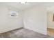 Cozy bedroom with neutral carpet, window for natural light, and fresh, white paint at 1340 Iola St, Aurora, CO 80010