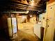 Basement with water heater, washer, and stairs to the main level at 767 S York St, Denver, CO 80209