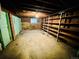 Unfinished basement with brick accents and open shelving ready for transformation at 767 S York St, Denver, CO 80209