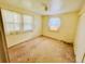 Simple bedroom with two windows providing natural light, ready for updates and personalization at 767 S York St, Denver, CO 80209