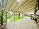 Spacious covered patio with concrete flooring and a view of the well-maintained yard at 767 S York St, Denver, CO 80209
