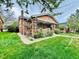 Charming brick home with a well-manicured lawn and inviting front porch at 767 S York St, Denver, CO 80209