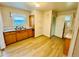 Functional kitchen with wood cabinets and laminate floors, ready for upgrades at 767 S York St, Denver, CO 80209