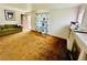 Cozy living room with carpet and large window and a vintage fireplace at 767 S York St, Denver, CO 80209