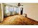 Spacious living room with carpet, ceiling fan, and natural light from large windows at 767 S York St, Denver, CO 80209