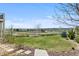 Expansive backyard with lush lawn, mature landscaping, and serene views of the surrounding neighborhood at 10597 Soulmark Way, Highlands Ranch, CO 80126